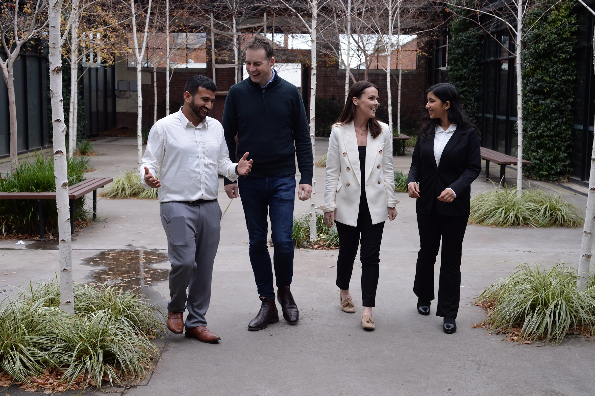 Hypergen team collaborating on AI strategy in a courtyard