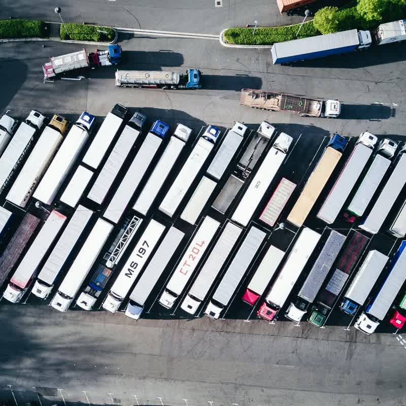 Aerial view of trucks at a distribution centre, representing AI vision for vehicle safety